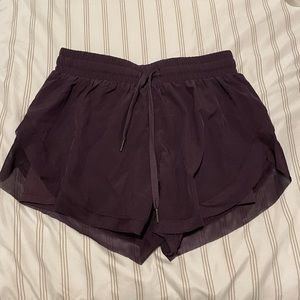 Dark purple Halara running shorts with liner.
